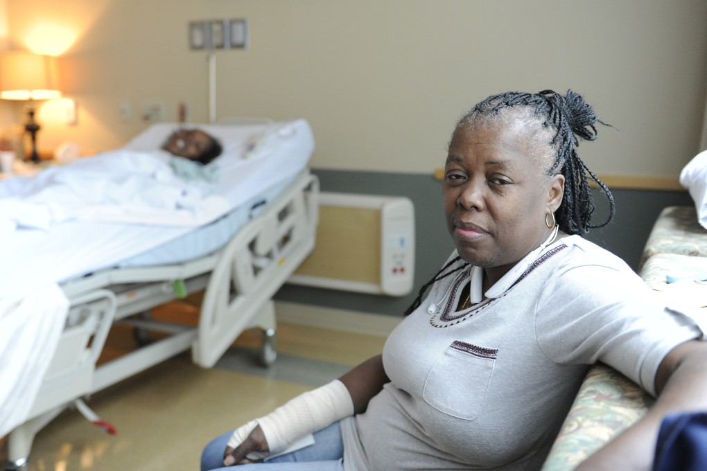 Chevelle Washington, right, sits in the hospital room of her sister, Chelette Price, in Houston. They were among New Orleans residents who fled to Texas in the wake of Hurricane Katrina but never returned. Photo: AP