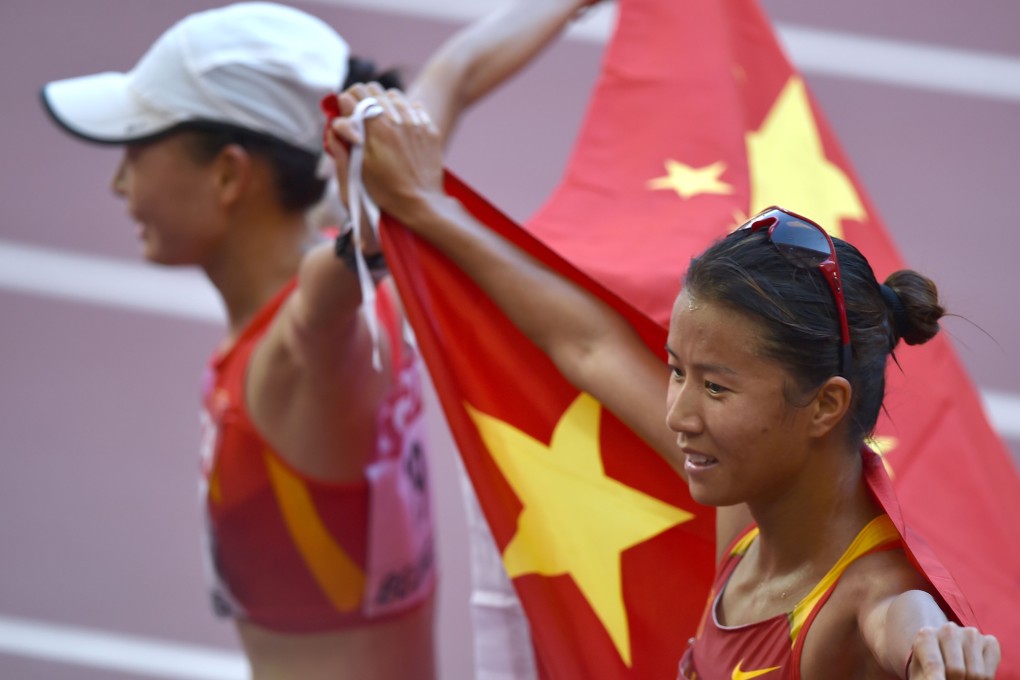 Liu Hong (R) and Lu Xiuzhi celebrate. Photo: AFP