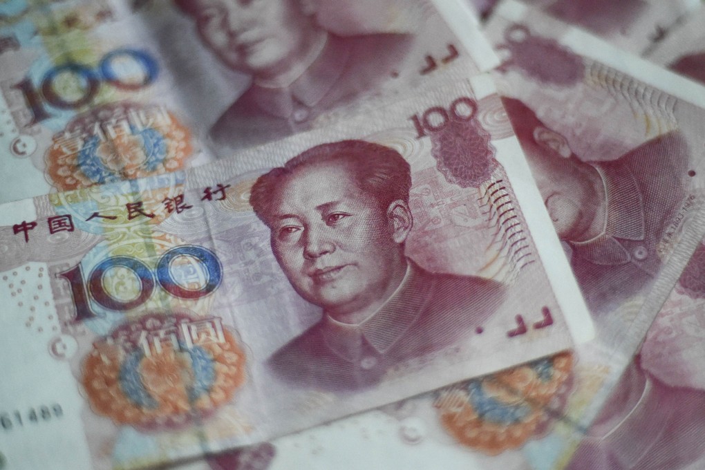Chinese yuan notes in Beijing as analysts mull which companies stand to benefit the most from a further depreciation of the currency. Photo: AFP