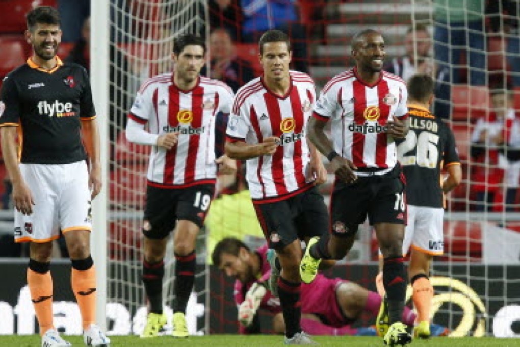 Jermain Defoe celebrates with teammates after scoring the third goal for Sunderland against Exeter City in the League Cup. Photo: Reuters