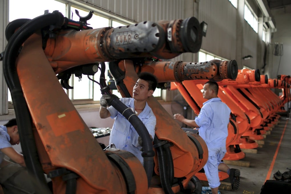 Workers at a robotics company in Shanghai. Manufacturing producer prices hit their lowest point in China since 2009 last month. Photo: Reuters