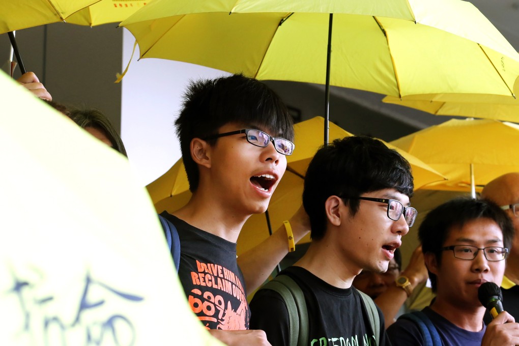 The four defendants (from left) Joshua Wong, Nathan Law, Raphael Wong and Albert Chan outside court before the hearing. Photo: Felix Wong