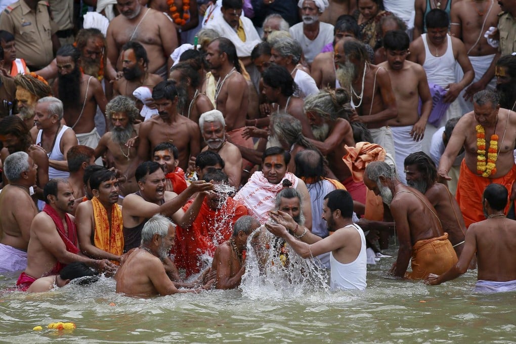 Hindu holy men take a dip in the Godavari river on the first day of the Kumbh Mela festival in Maharashtra state.Photo: Reuters