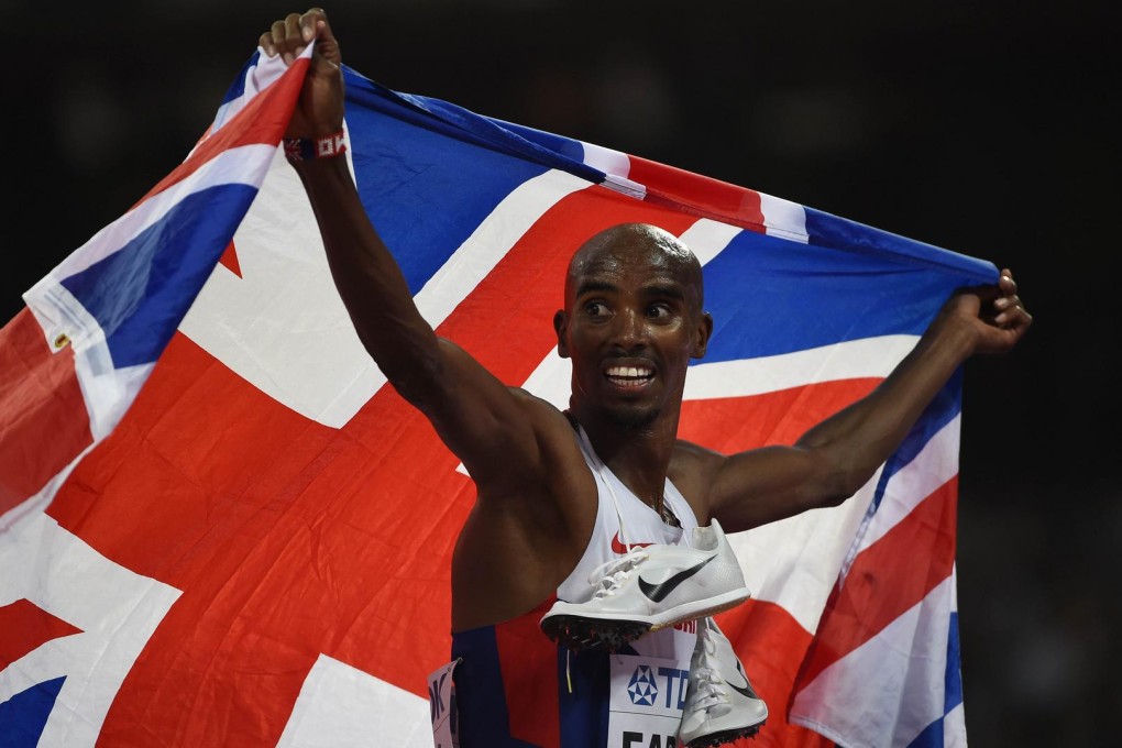 Britain's Mo Farah celebrates winning the final of the men's 5,000 metres at the world championships in Beijing. Photo: AFP