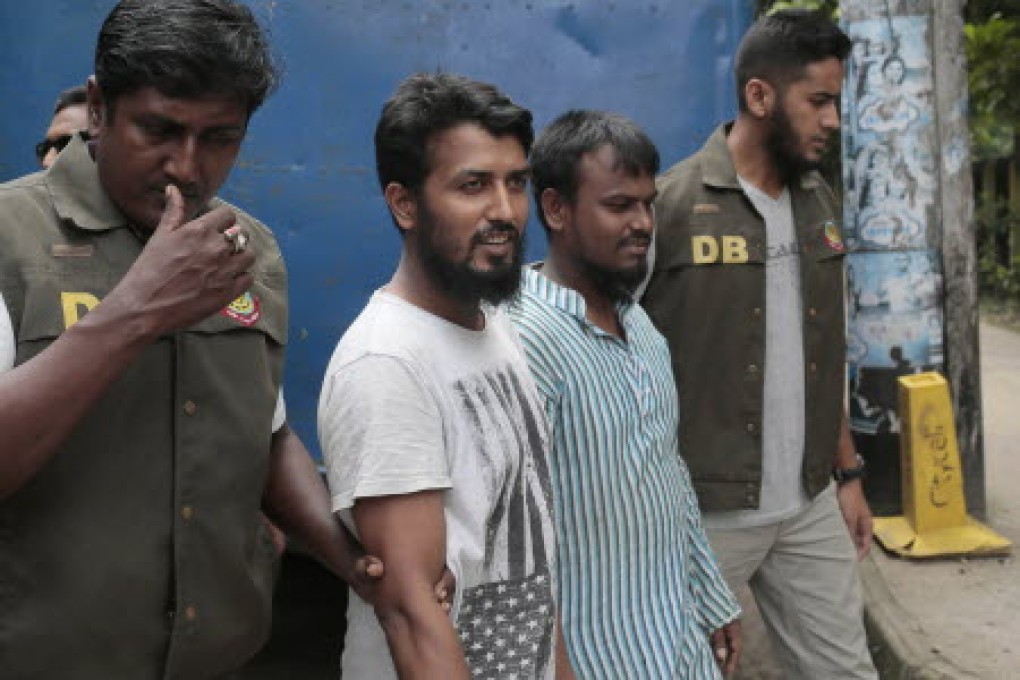Suspected Muslim militants Kausar Hossain Khan, 29, second from right, and Kamal Hossain Sardar, 29, second from left. Photo: AP
