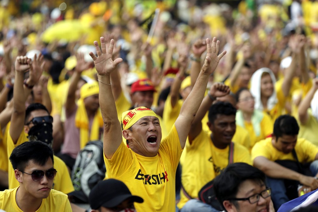Malaysian protesters chant during a Bersih (the local word for clean) anti-government rally in Kuala Lumpur. Photo: EPA