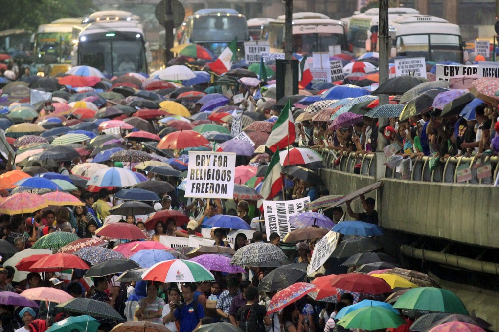 Protesters belonging to the Iglesia ni Cristo (Church of Christ) group march along EDSA highway in Mandaluyong, Metro Manila. Photo: Reuters