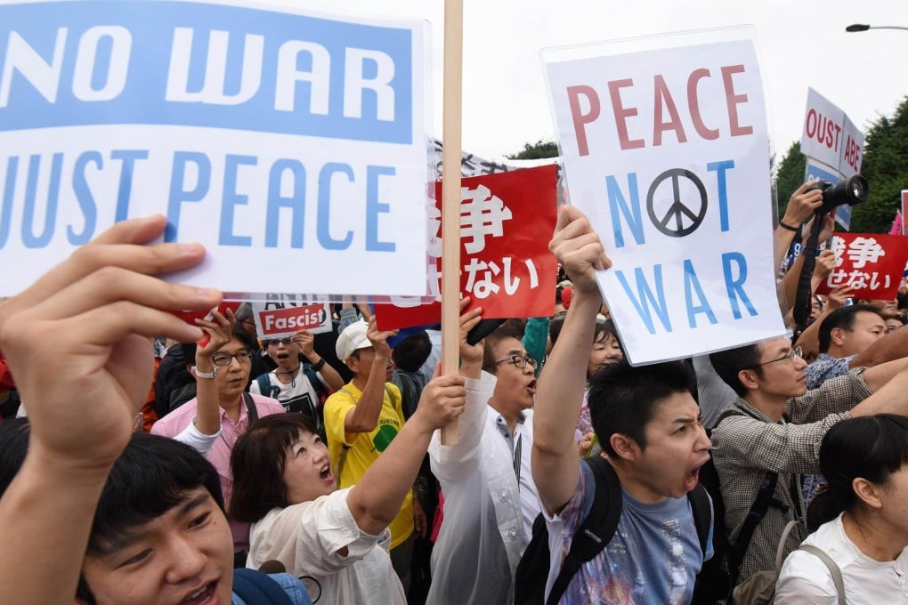 Anti-government protesters assemble outside the Japanese Diet on Sunday. Photo: AFP