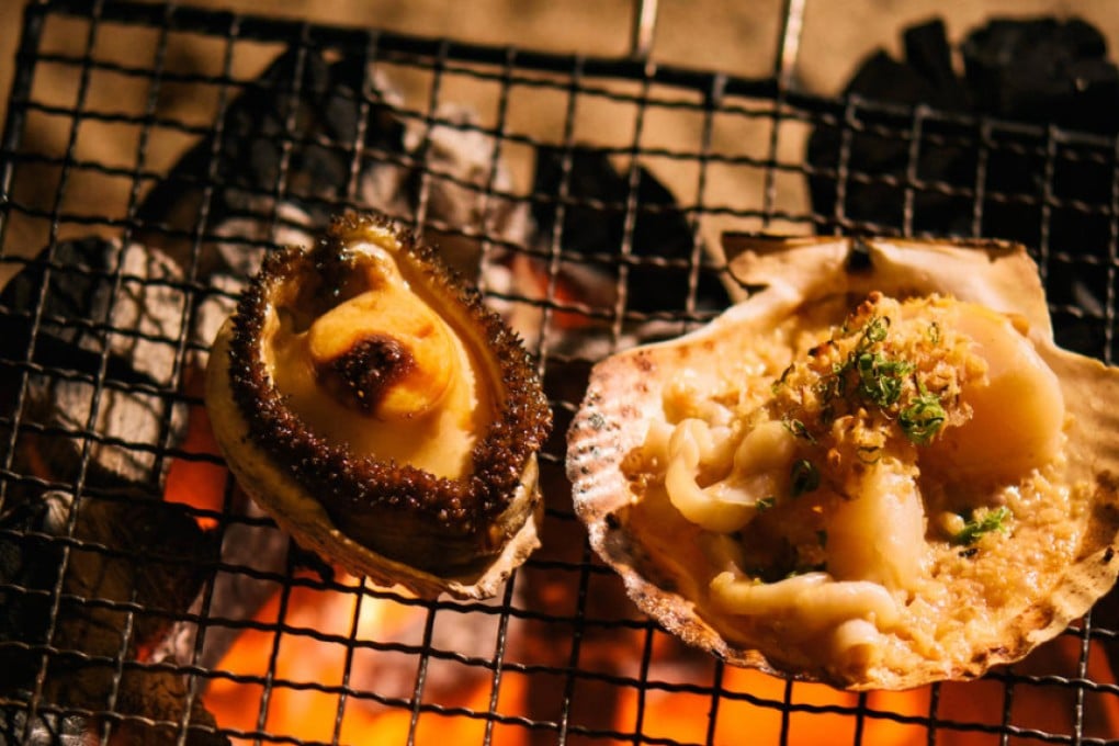 Abalone and scallop appetisers prepared with a Japanese binchotan charcoal grill at Shoku Bar and Restaurant. Photo: Lit Ma