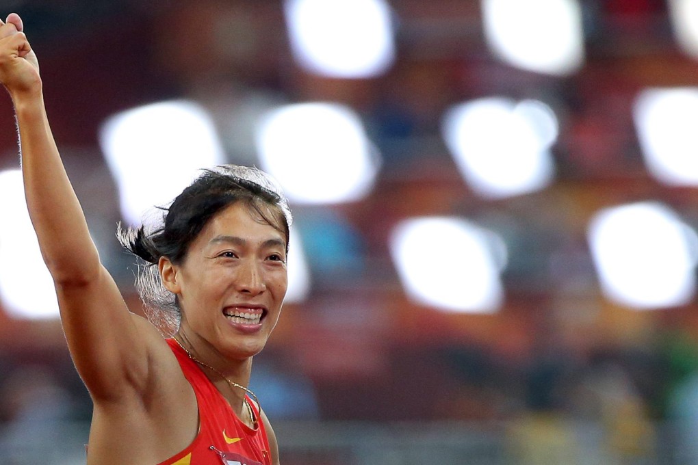 Lyu Huihui celebrates her javelin medal. Photo: EPA