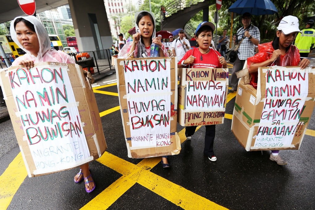 Hundreds of Filipino migrants march to the Philippine Consulate General in Hong Kong calling for the complete abandonment of the Philippine government's imposition of tax through the Bureau of Customs on their balikbayan/door-to-door boxes. Photo: Nora Tam