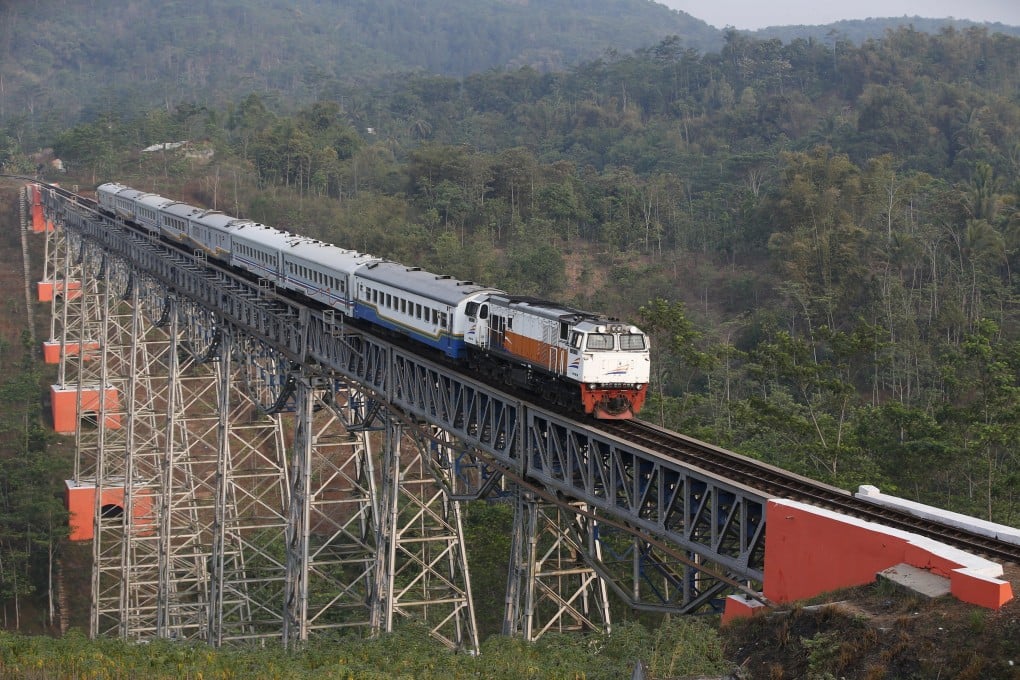 A train travels on the existing track between Jakarta and Bandung. China's bid to build a high-speed link is currently preferred because it is less financially burdensome, according to a government source. Photo: Reuters