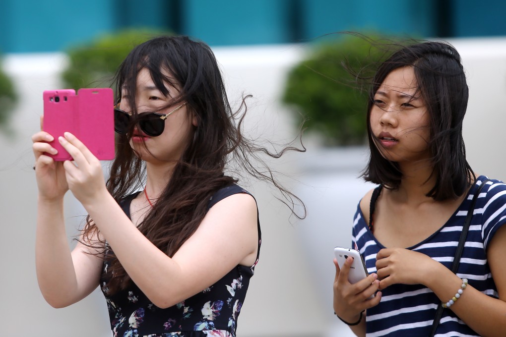 Hong Kong smartphone users are among the clumsiest in Asia, according to a new report. Photo: Sam Tsang