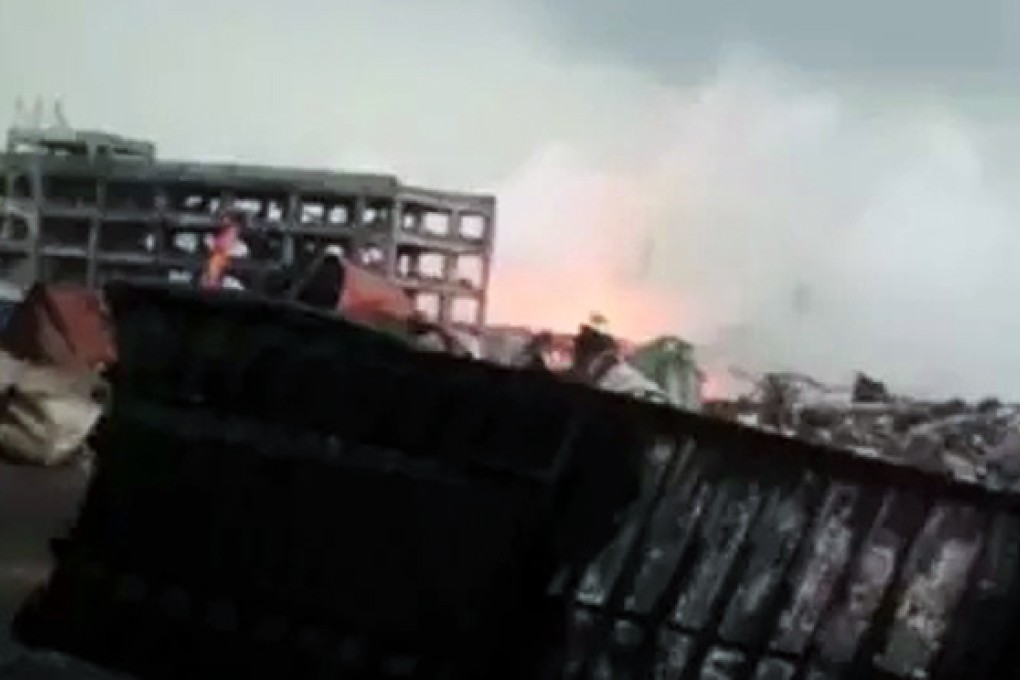 A chemical fire burns in Tianjin at the site of deadly explosions two weeks ago. Photo: SCMP Pictures