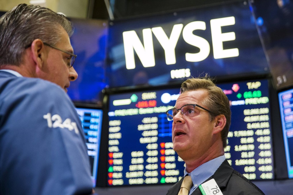 Traders on the floor of the New York Stock Exchange. Photo: Reuters