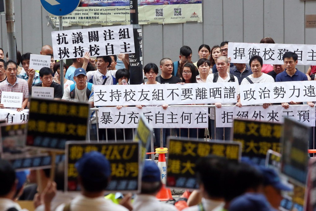 Protesters gather outside the meeting at the Convention and Exhibition Centre. Photo: Sam Tsang