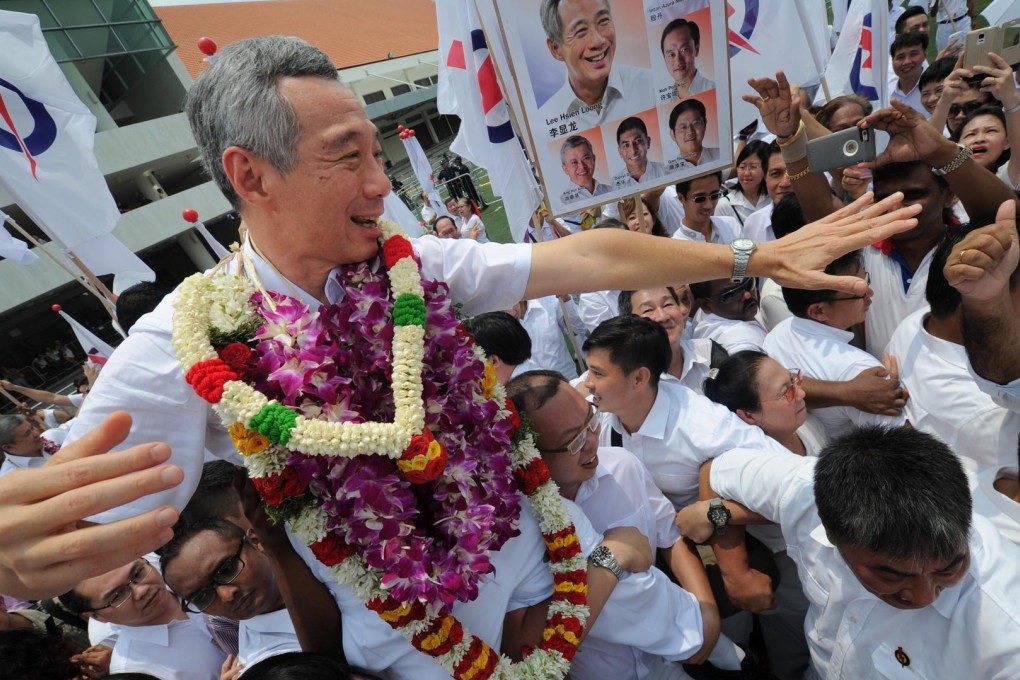 Singapore's Prime Minister Lee Hsien Loong interacts with supporters of his People's Action Party as campaigning begins. Photo: Xinhua