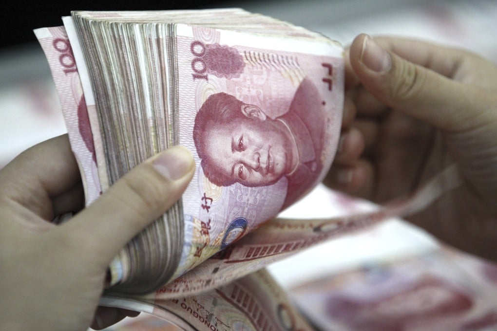 The planned change by the People's Bank of China will mandate a deposit of 20 per cent of sales to be held at zero interest and frozen for a year. Photo: AP