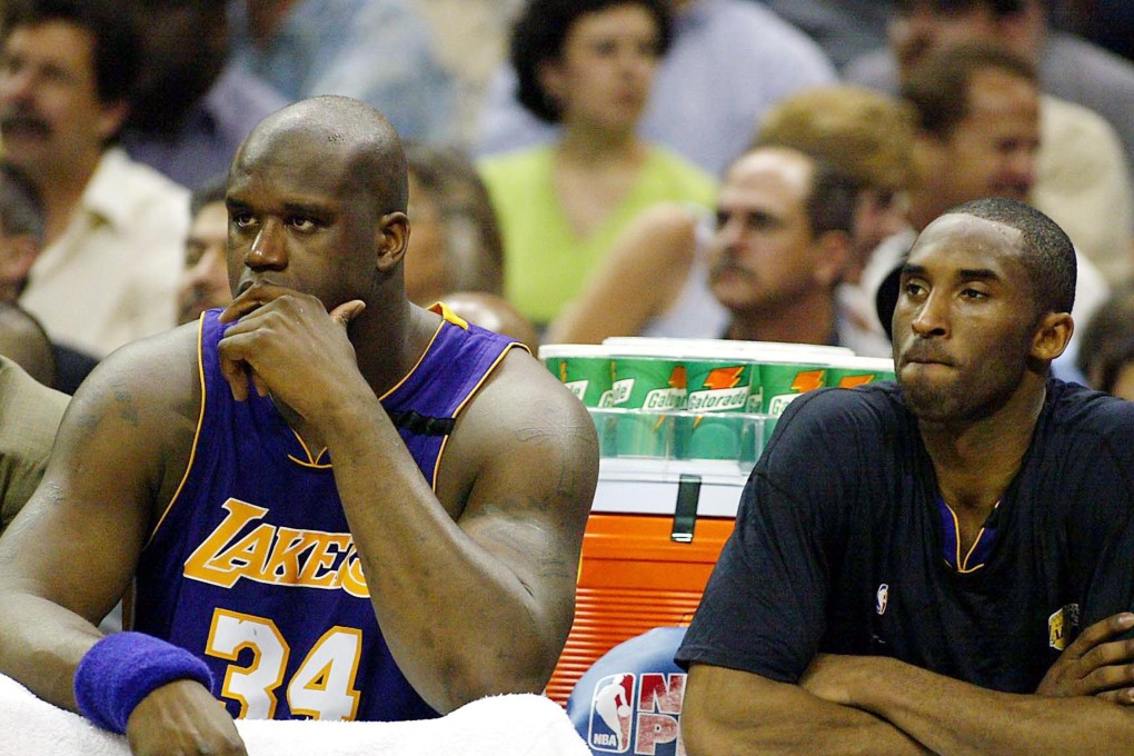 Shaquille O'Neal  and Kobe Bryant keep their distance while sitting on the Lakers bench in a game in 2003. Photo: AFP