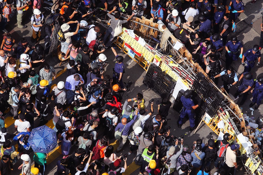 Police officers clash with pro-democracy protesters during clearance operation on Nathan Road in Mong Kok occupied site on November 26, 2014. Photo: Sam Tsang