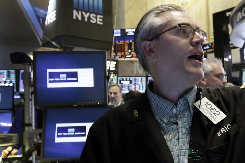 Traders work the floor of the New York Stock Exchange as shares fell over fears the US Federal Reserve could raise rates this month. Photo: AP