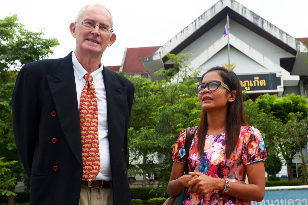 Australian journalist Alan Morison with Thai colleague Chutima Sidasathian at the provincial court in Phuket island. Photo: AFP