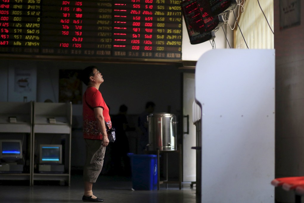 The brokerages will contribute 20 per cent of net assets as of July 31 to a special account held by the China Securities Finance Corp for investments in blue chips and exchange-traded funds. Photo: Reuters