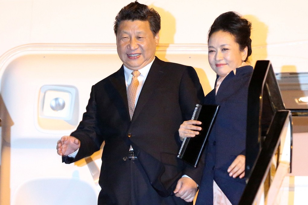 China's President Xi Jinping and his first lady Peng Liyuan are the picture of bliss as they arrive in Auckland on a trip to New Zealand last year. Photo: AFP