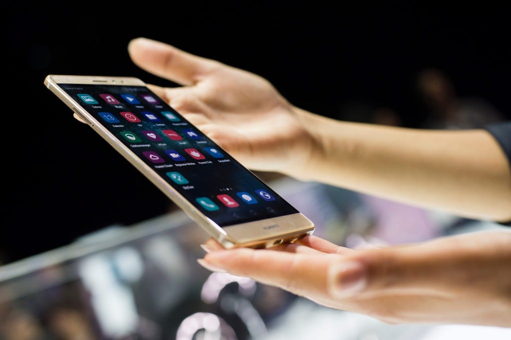 A visitor holds the new 'Mate S' smartphone at the IFA in Berlin on Tuesday. Photo: EPA