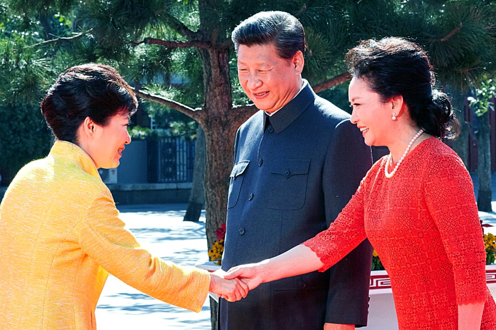 South Korean President Park Geun-hye (L) is welcomed by Chinese President Xi Jinping (C) and his wife Peng Liyuan at Tiananmen Square. Photo: EPA