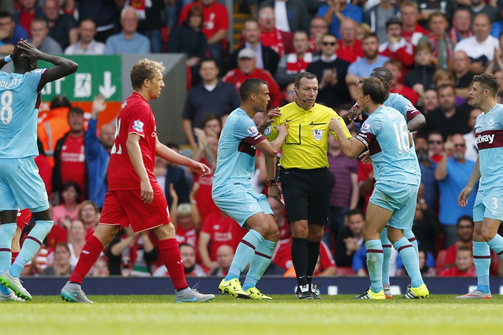 Mark Noble's red card against Liverpool has been rescinded on further review. He will serve no ban. Photo: Reuters