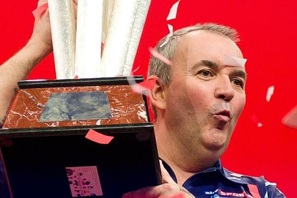 Phil Taylor is the most decorated darts player of all time. Photo: AFP
