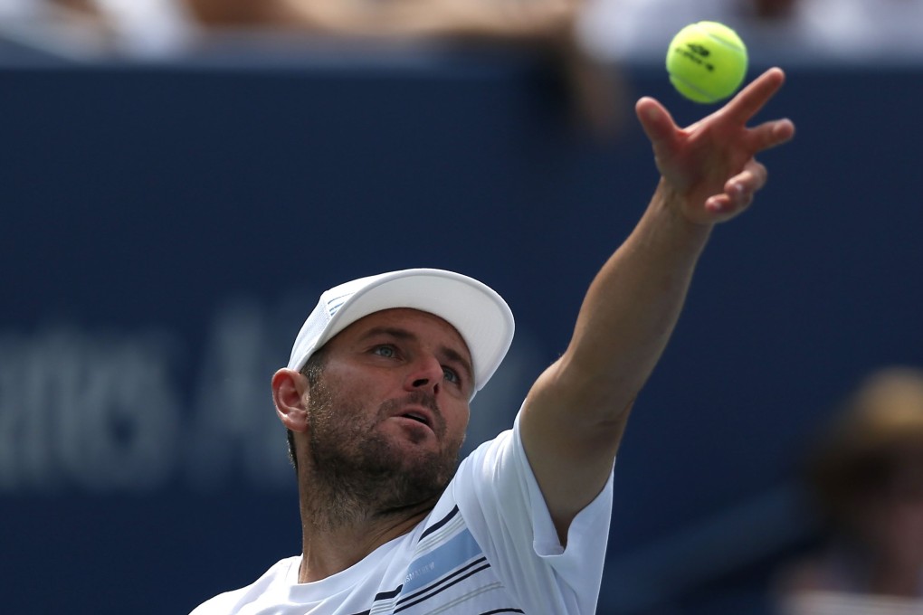 Mardy Fish of the United States retired after his loss to Feliciano Lopez. Photo: AFP