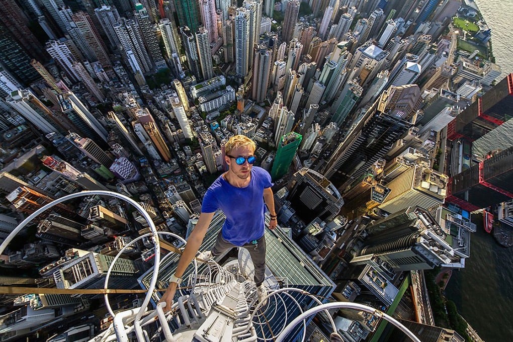 A daredevil scales one of Hong Kong's highest buildings. Photo: SCMP Pictures