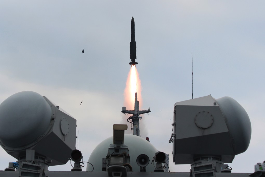 An air defence missile is launched from frigate Changzhou during a drill in the East China Sea. The Chinese navy is extending its reach and was spotted this week in waters off Alaska. Photo: Xinhua