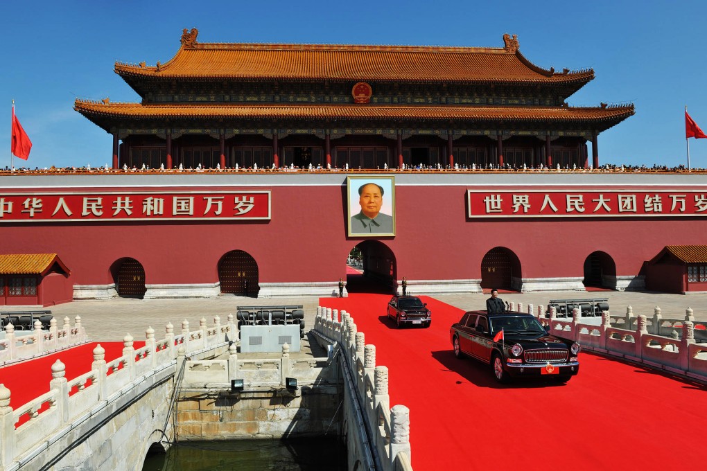 President Xi Jinping rides to inspect troops in central Beijing amid ‘parade blue’ skies on Thursday – in sharp contrast to the rain and smog that set in yesterday (below). Photos: Xinhua, Simon Song