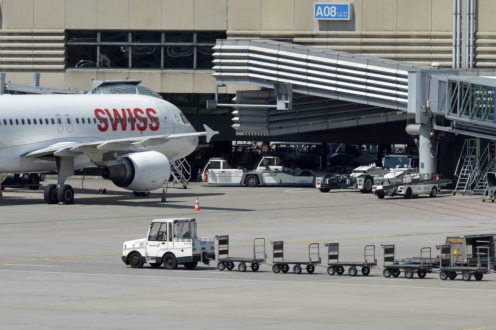 A Swissport baggage cart is seen in Zurich airport as luggage handler Swissport was bought by China's HNA Group, which has acquired one of the world’s largest aircraft lessors, Avolon Holdings. Photo: EPA