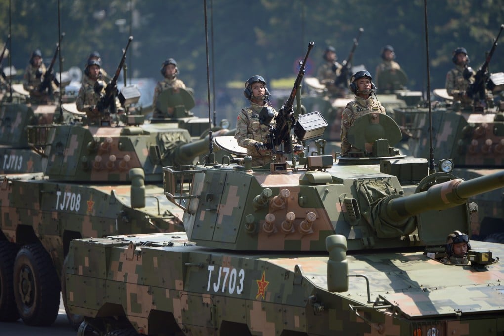 Wheeled armored assault vehicles attend the military parade on Thursday in Beijing. Photo: Xinhua