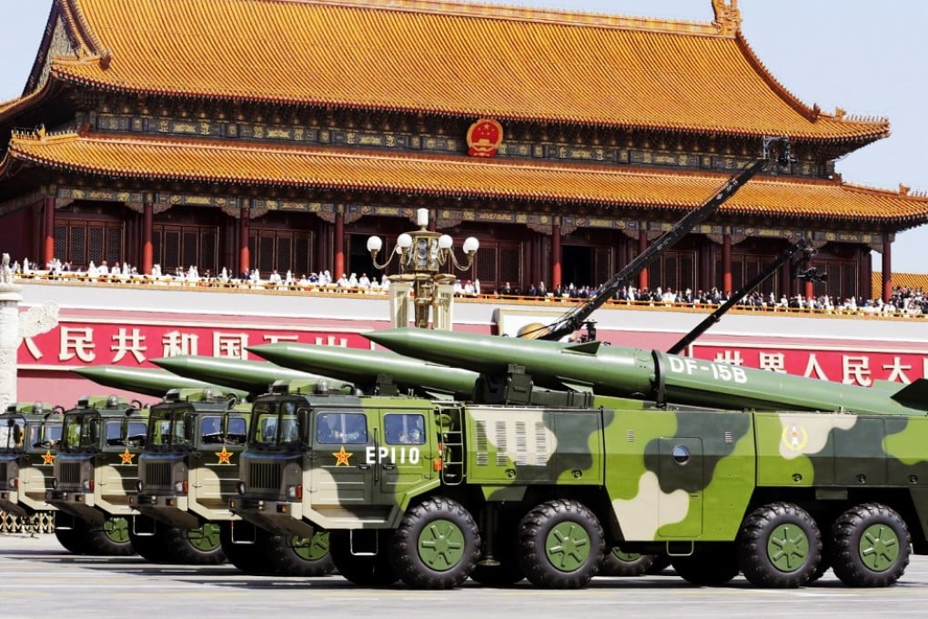 Military vehicles carrying DF-15B short-range ballistic missiles, shown in public at China's September 3 parade. Photo: Reuters