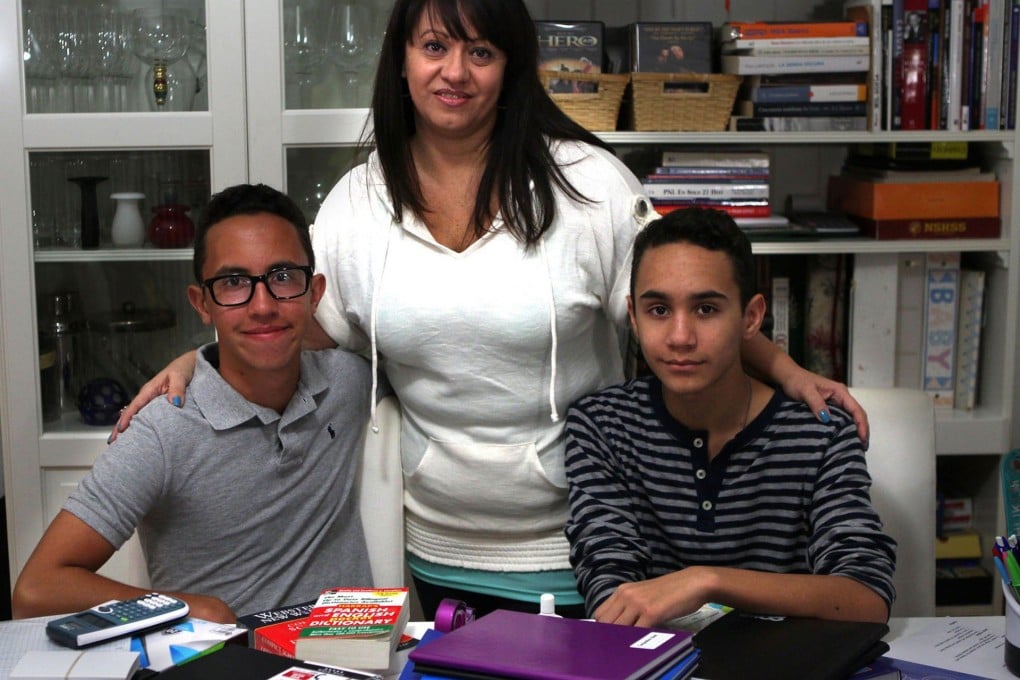Maria Gabriela Salas with sons Armando (left) and Gabriel Torrealba. Photo: Peter Andrew Bosch