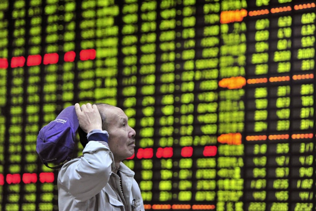 A perplexed investor stares at stock prices in China's stock markets as officials said the volatility in Shanghai and Shenzhen is dissipating and that the markets are stabilizing after a prolonged rout since scaling a 7-year peak in mid-June. Photo: Reuters