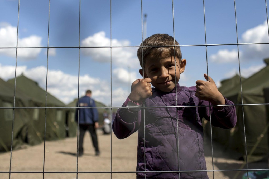 A boy from Damascus, Syria, at a newly opened reception camp for migrants near the village of Roszke in Hungary. Photo: Reuters
