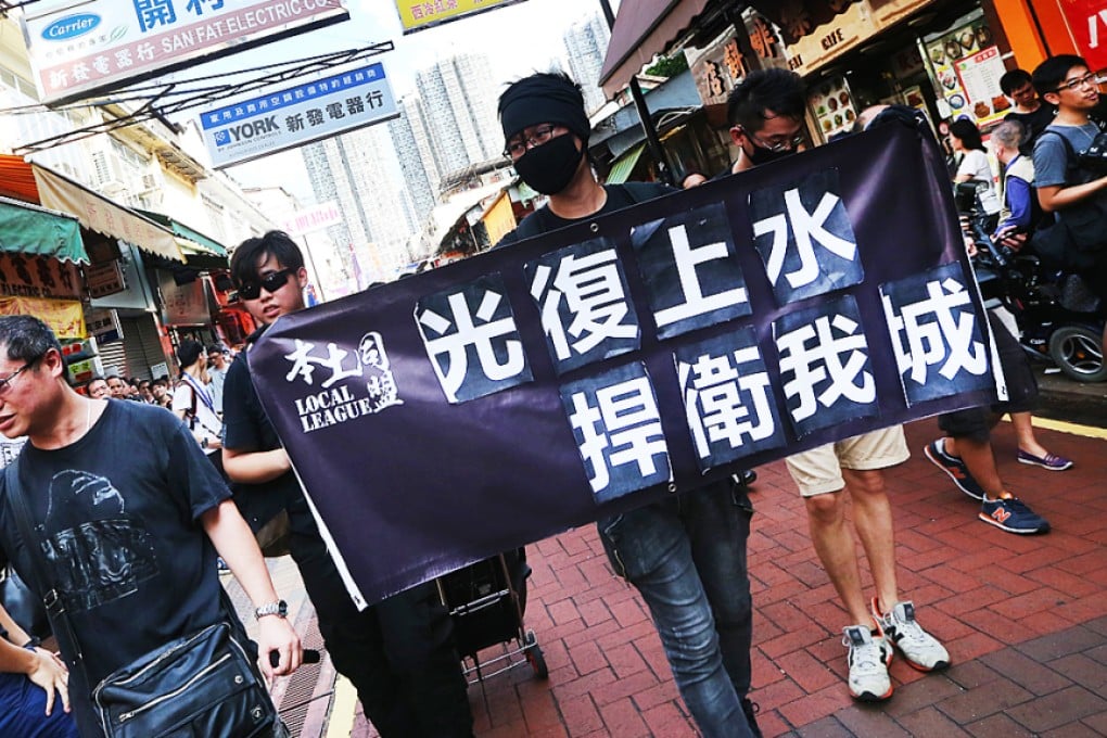 Localists protest against parallel trading in Sheung Shui on Sunday. Photo: David Wong