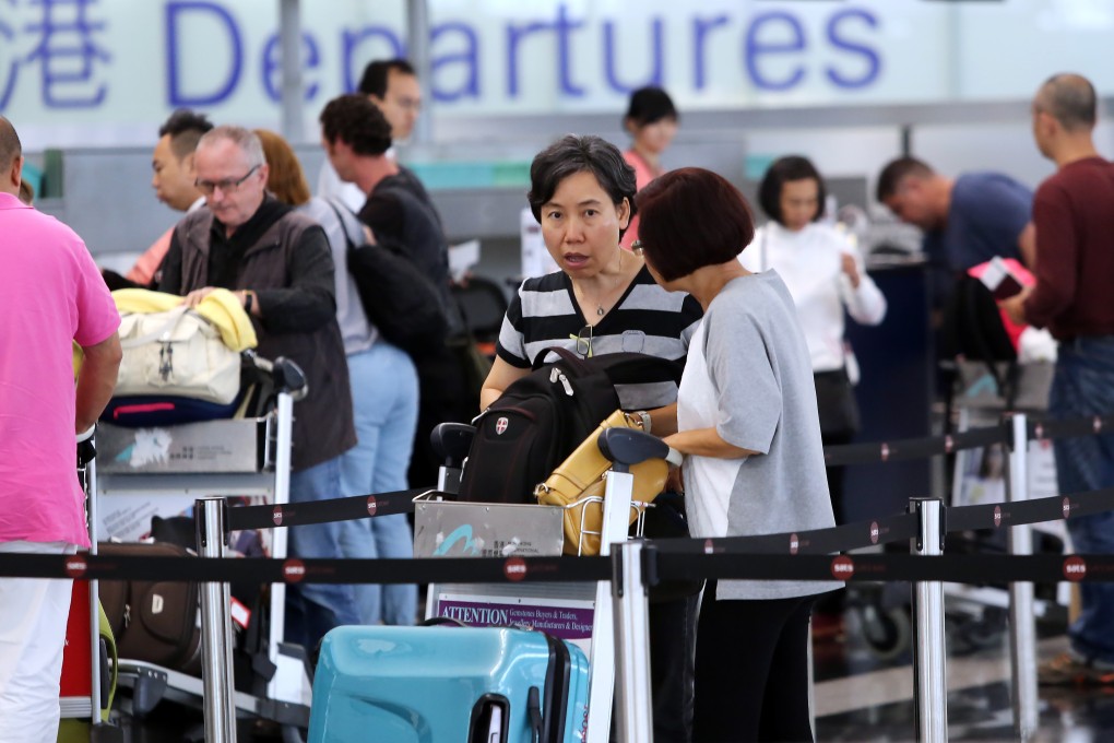 A levy on airport passengers may be set lower than the proposed HK$180, the transport minister says. Photo: Sam Tsang