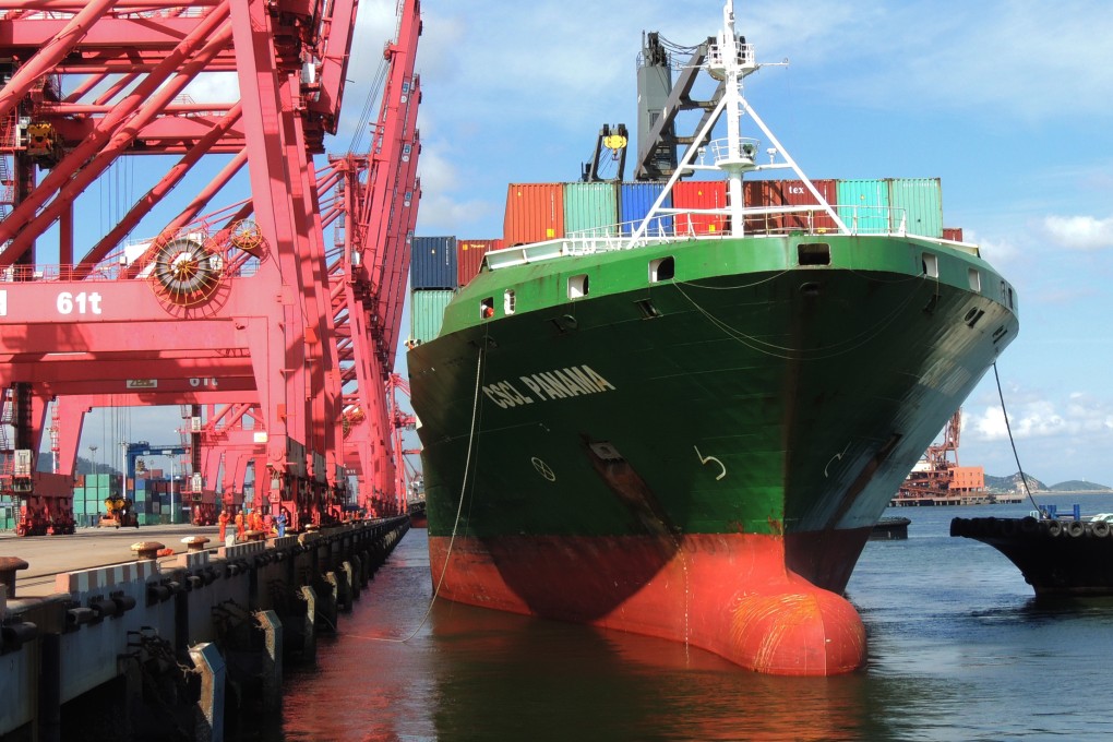 Containers are unloaded from a cargo ship in Lianyungang, Jiangsu province. China's imports fell in August for the tenth consecutive month. Photo: Xinhua