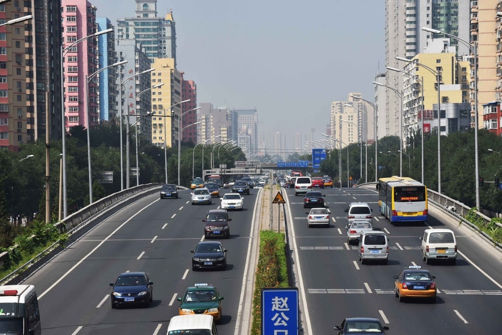 Vehicles coast down a road in Beijing, China's capital. Photo: Xinhua