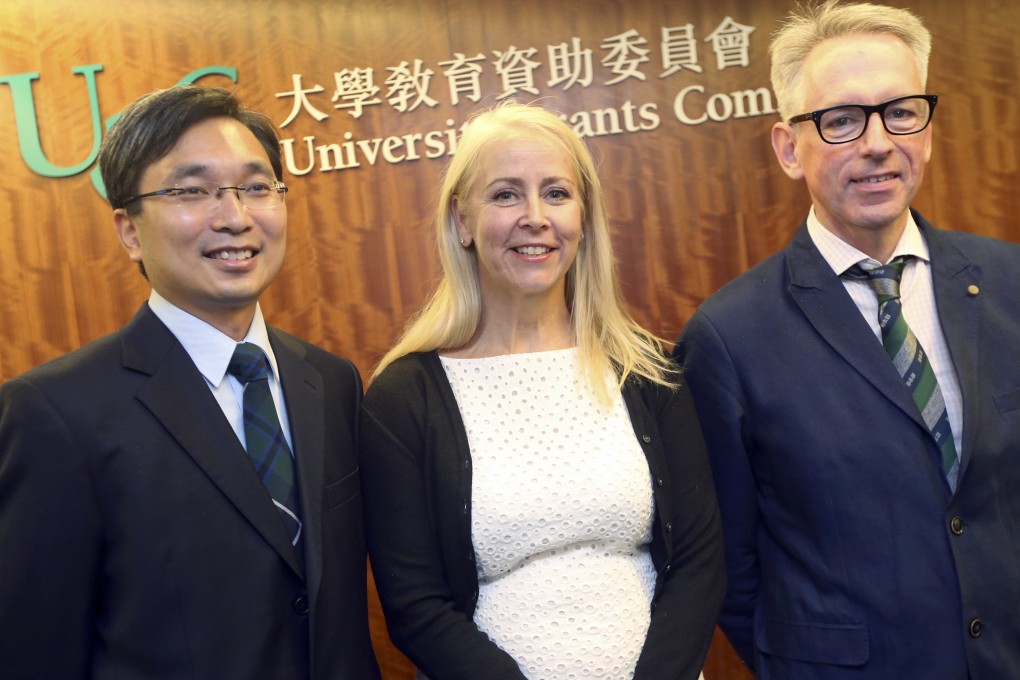 Kam-tim Woo, Gail Forey and Dr Michael Botelho pick up their awards. Photo: David Wong