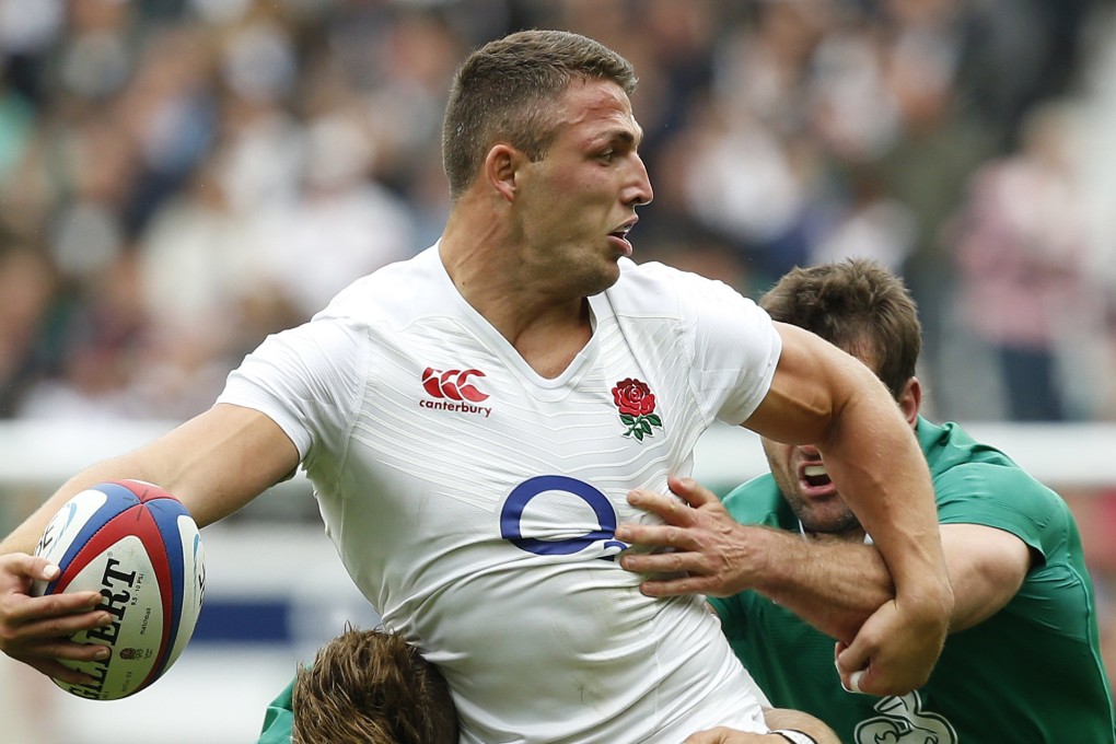 England’s Sam Burgess tries to offload in the tackle against Ireland at Twickenham last weekend. Three-time World Cup veteran Simon Shaw says Burgess "looked scared and like he didn’t know what the hell was going on". Photo: AP