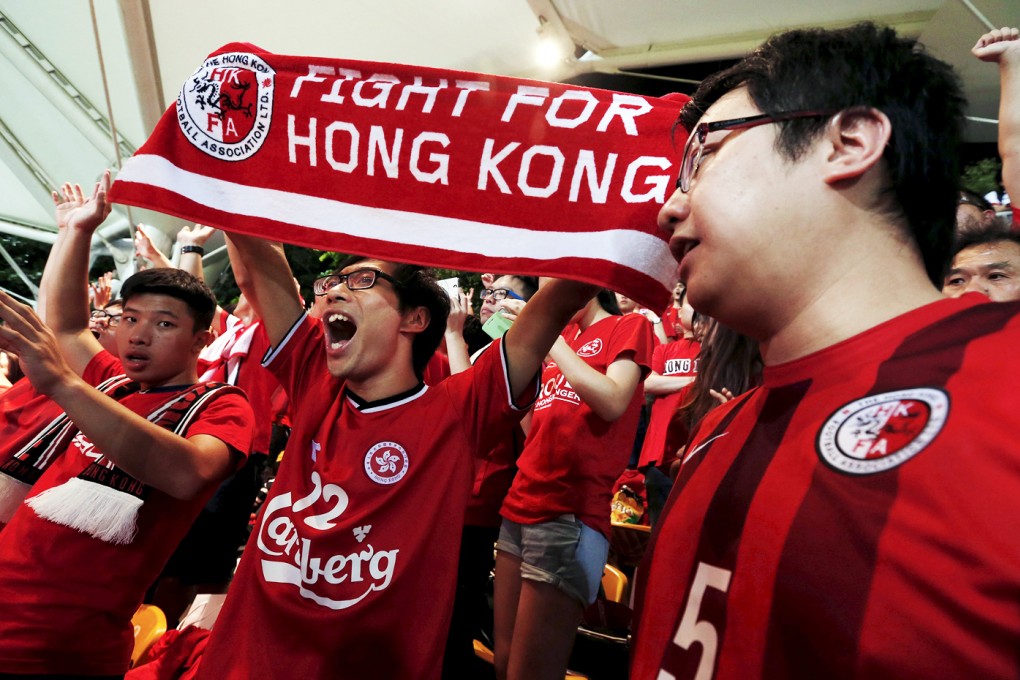 Hong Kong fans sing at the World Cup qualifying match against Qatar at Mong Kok on Tuesday. Photo: Reuters
