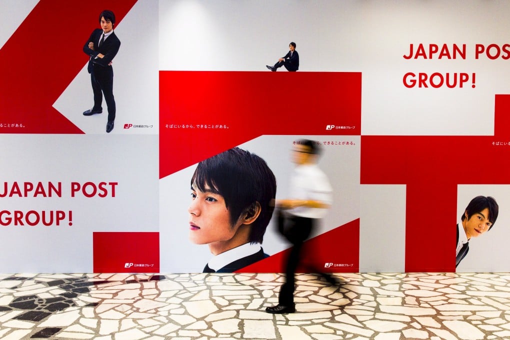 Japan Post Holdings and its bank and insurance units will begin trading in the stock market in November. Photo: Reuters